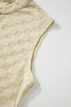 Textured sleeveless cream checkered romper with band collar detail.