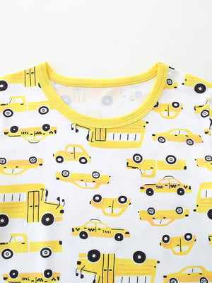 Toddler pajama set with yellow cartoon car print and bright yellow trim.