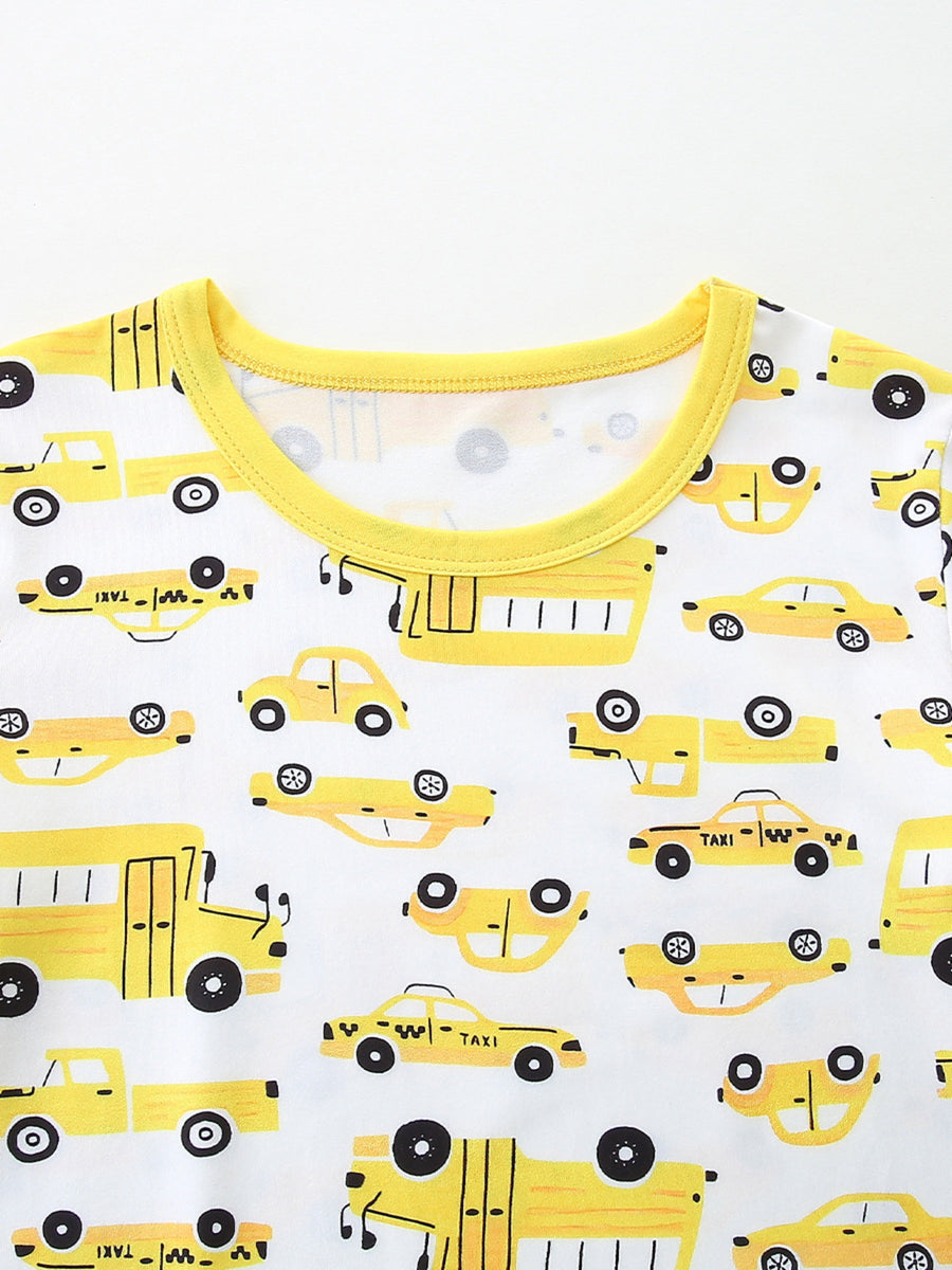 Toddler pajama set with yellow cartoon car print and bright yellow trim.