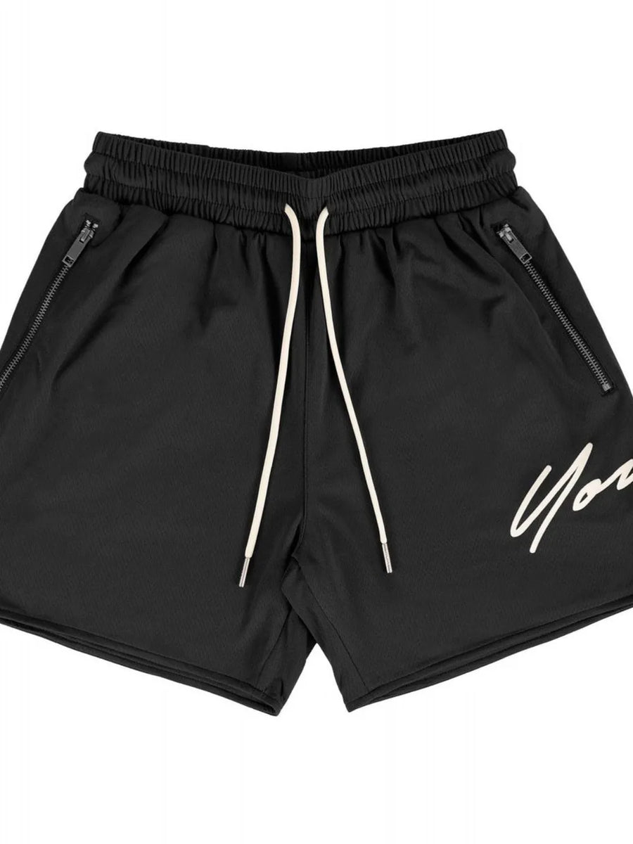 Black BigFit jogger shorts with drawstring and zippered pockets, featuring a white script logo.