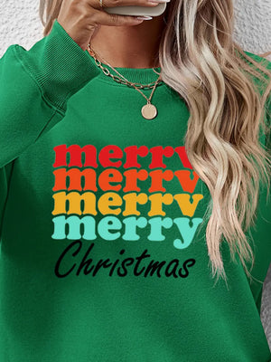 Green crewneck sweatshirt with retro "merry merry merry Christmas" graphic in red, orange, yellow, and teal.