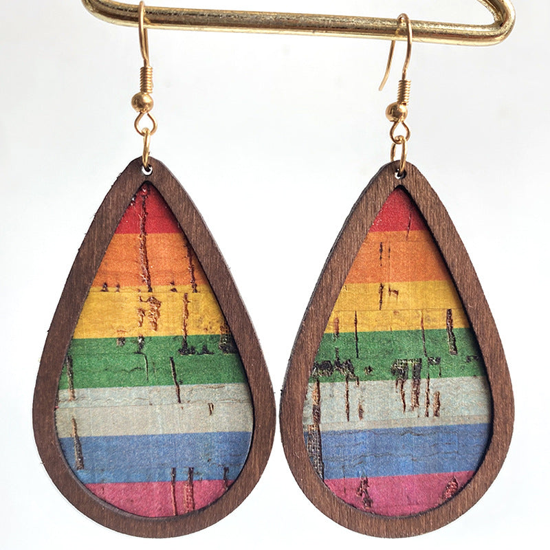 Cork & Stripe Teardrop Statement Earrings with rainbow pattern and wooden frame.