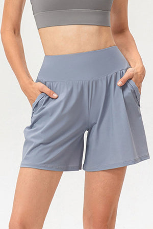 Light blue active shorts with pockets and a wide waistband.
