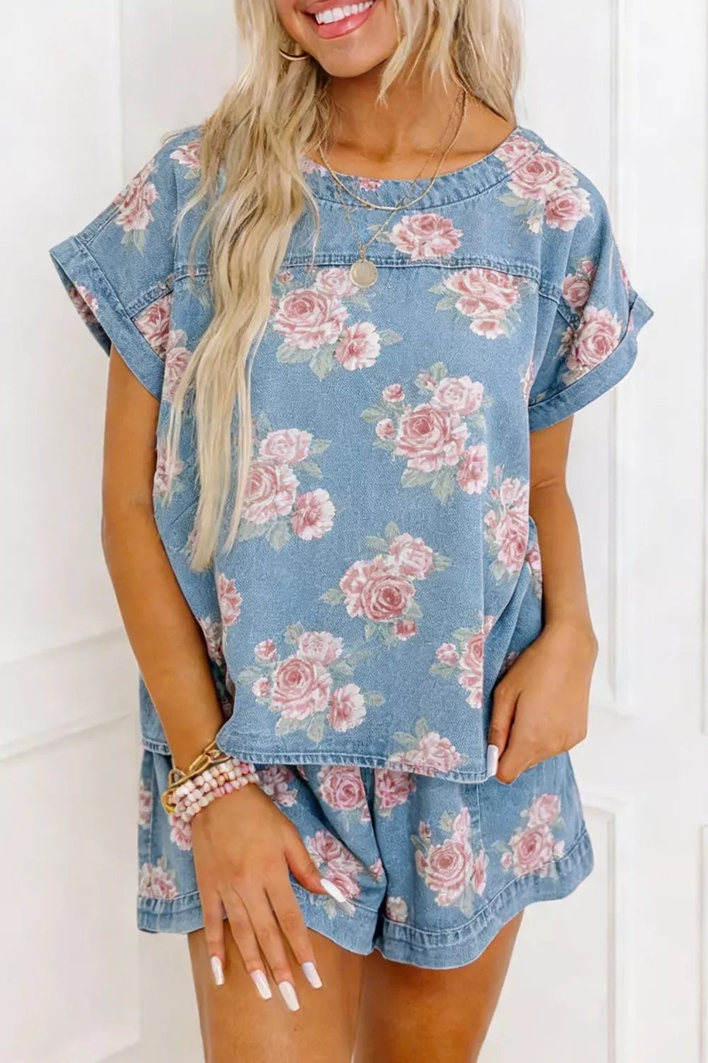 Floral denim two-piece set with short sleeves and shorts.