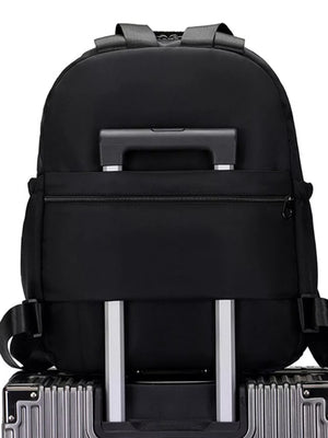 Black Oxford cloth backpack with trolley sleeve and adjustable straps.