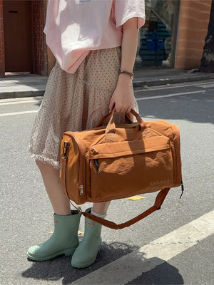 Caramel Oxford cloth travel bag with detachable strap and exterior pockets