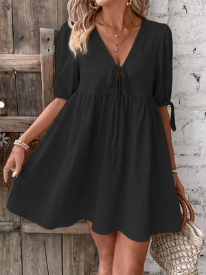 Black tie front puff sleeve mini dress with adjustable sleeve ties