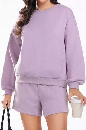 Cozy two-piece sweatshirt set in Pink Purple, featuring a crewneck sweatshirt and drawstring shorts.