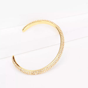 18K Gold-Plated, Copper, Zircon Care instructions: Avoid wearing during exercise bracelet in clear with open cuff silhouette