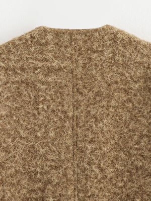 Textured knit cardigan in dark brown with a fuzzy, marled finish and a seam down the back.