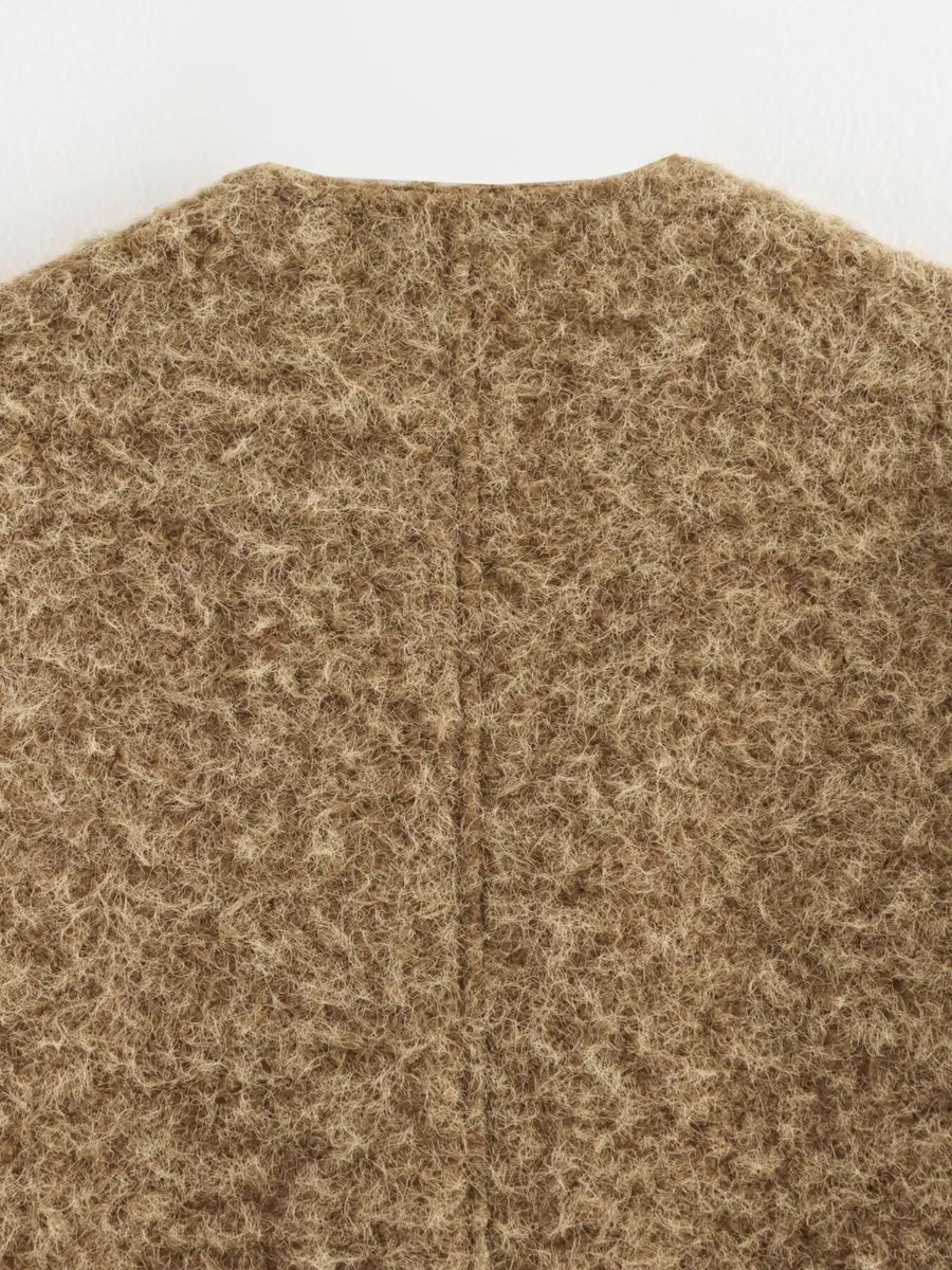 Textured knit cardigan in dark brown with a fuzzy, marled finish and a seam down the back.