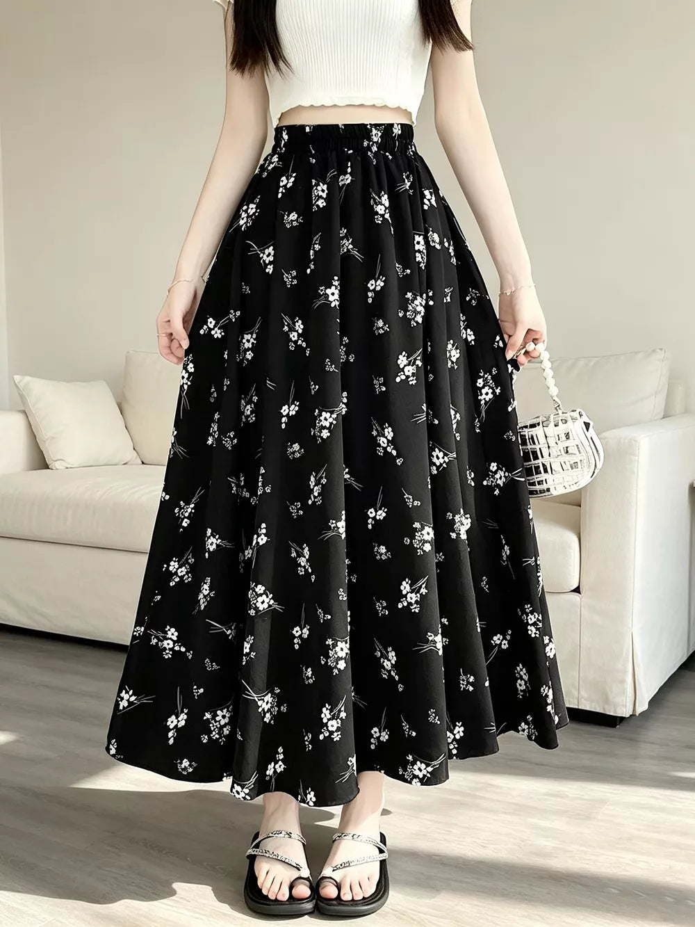 A-line skirt featuring ditsy floral in White with 100% polyester Care instructions: Machine wash cold texture