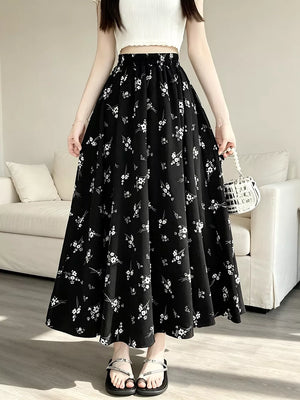 A-line skirt featuring ditsy floral in White with 100% polyester Care instructions: Machine wash cold texture