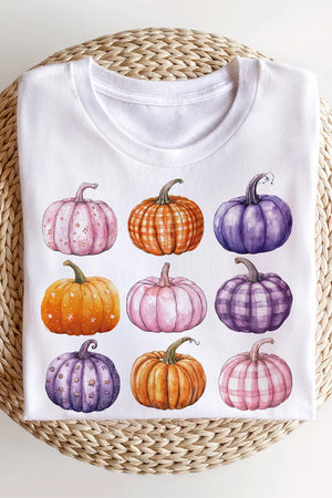 White crewneck sweatshirt with watercolor pumpkins in pink, orange, and purple patterns.
