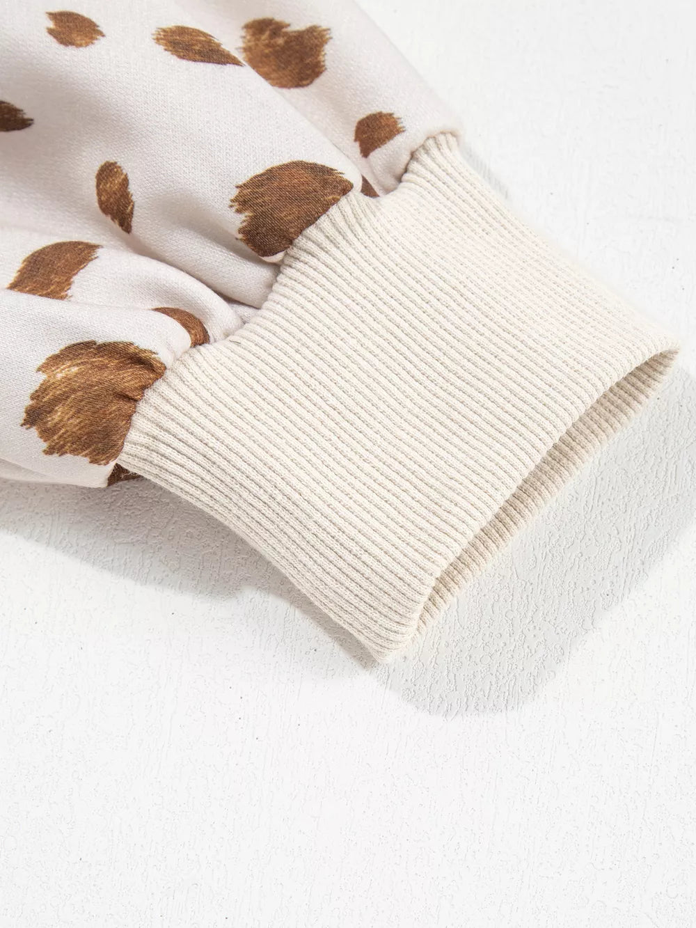 cream sweatshirt with ribbed cuffs and long sleeve