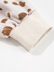 cream sweatshirt with ribbed cuffs and long sleeve