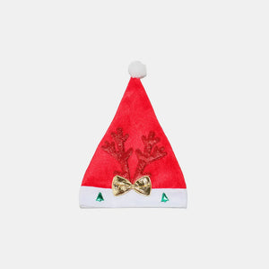 Red festive party hat with glitter antlers, gold bow, and green trees.