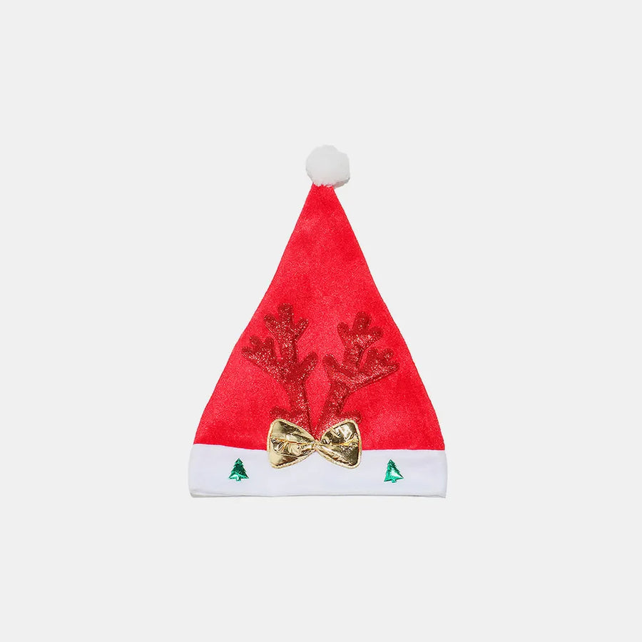 Red festive party hat with glitter antlers, gold bow, and green trees.