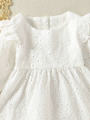 White cotton eyelet baby top with ruffled sleeves and gathered waist