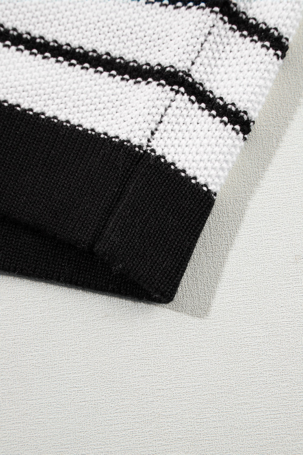 Black and white striped knit sweater with contrast trim detail