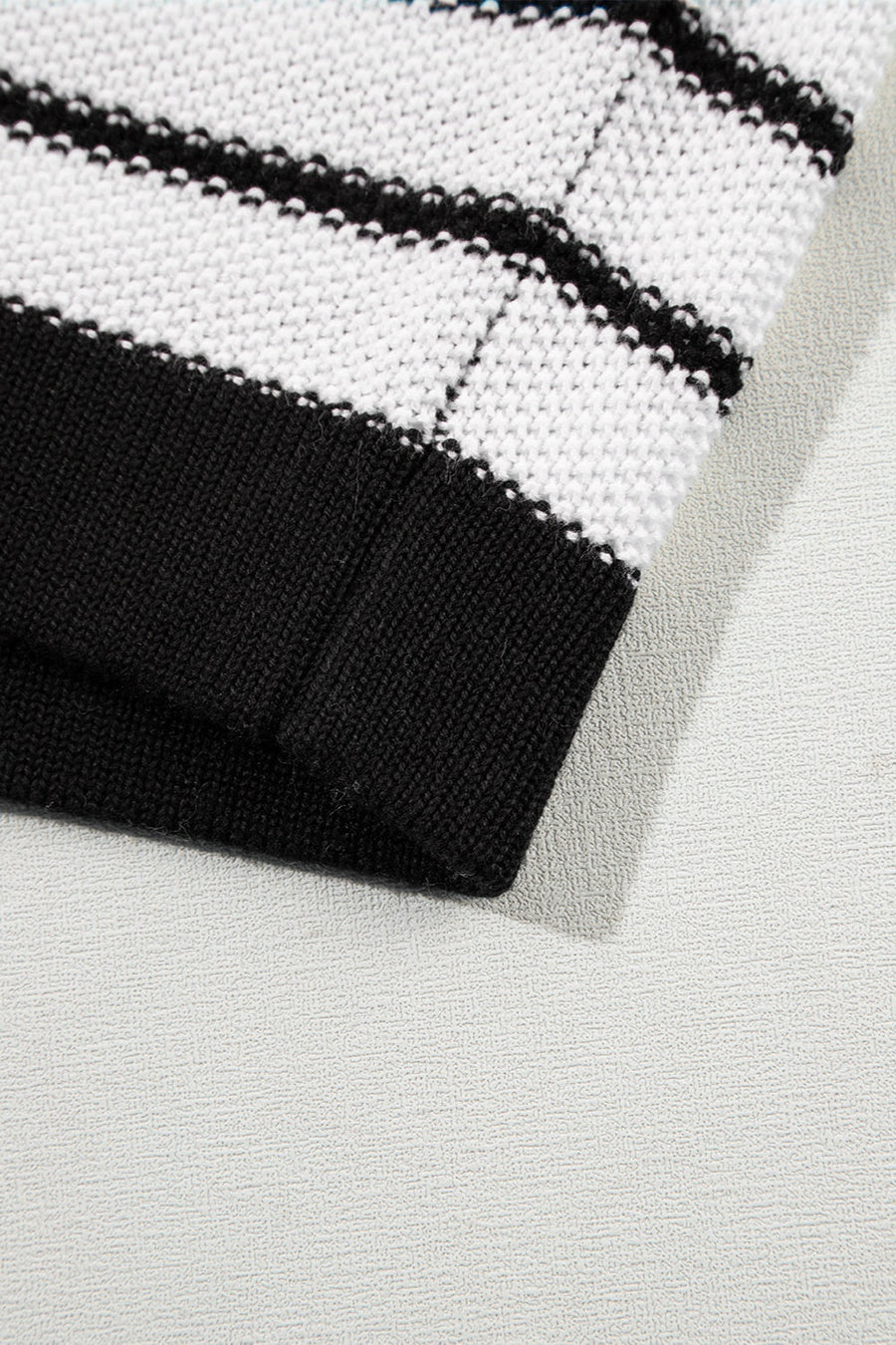 Black and white striped knit sweater with contrast trim detail