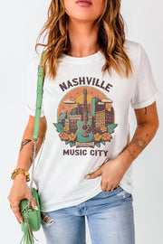 White graphic t-shirt with Nashville Music City skyline and guitar art.