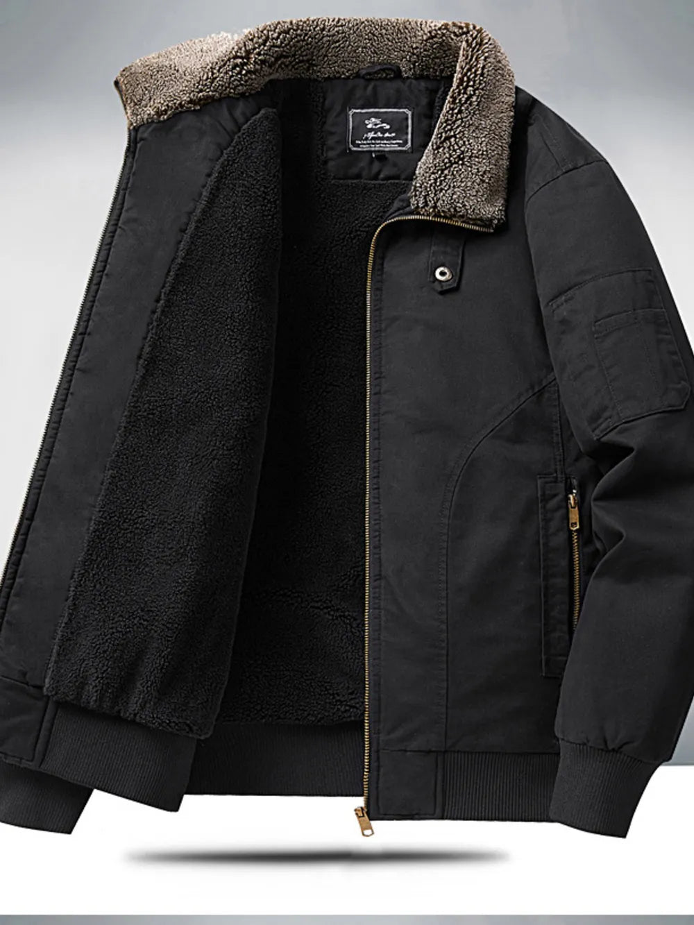 Black sherpa lined bomber jacket with plush collar and zip front.