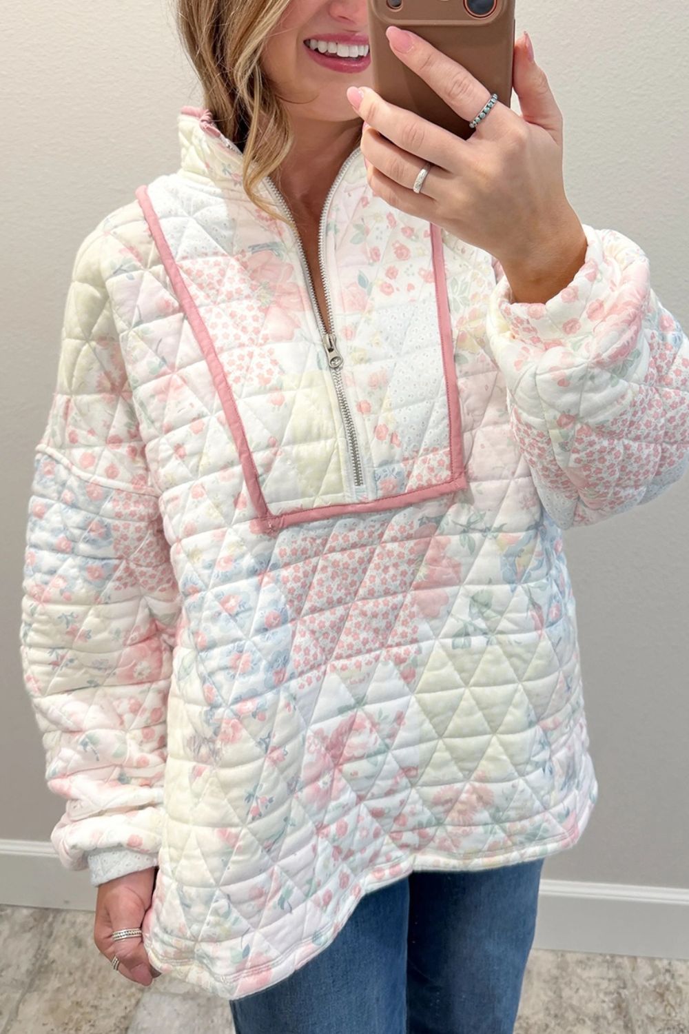 light pink sweatshirt featuring pocketed and floral