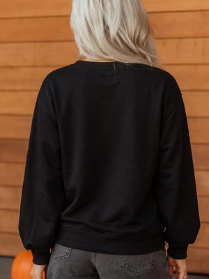 orange sweatshirt featuring chenille patch and graphic-print
