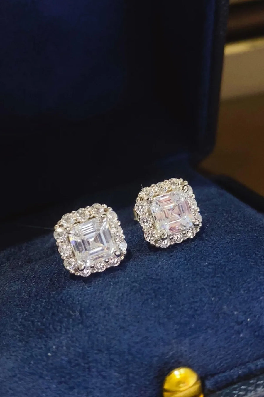 Asscher cut halo earrings in silver with sparkling cubic zirconia.