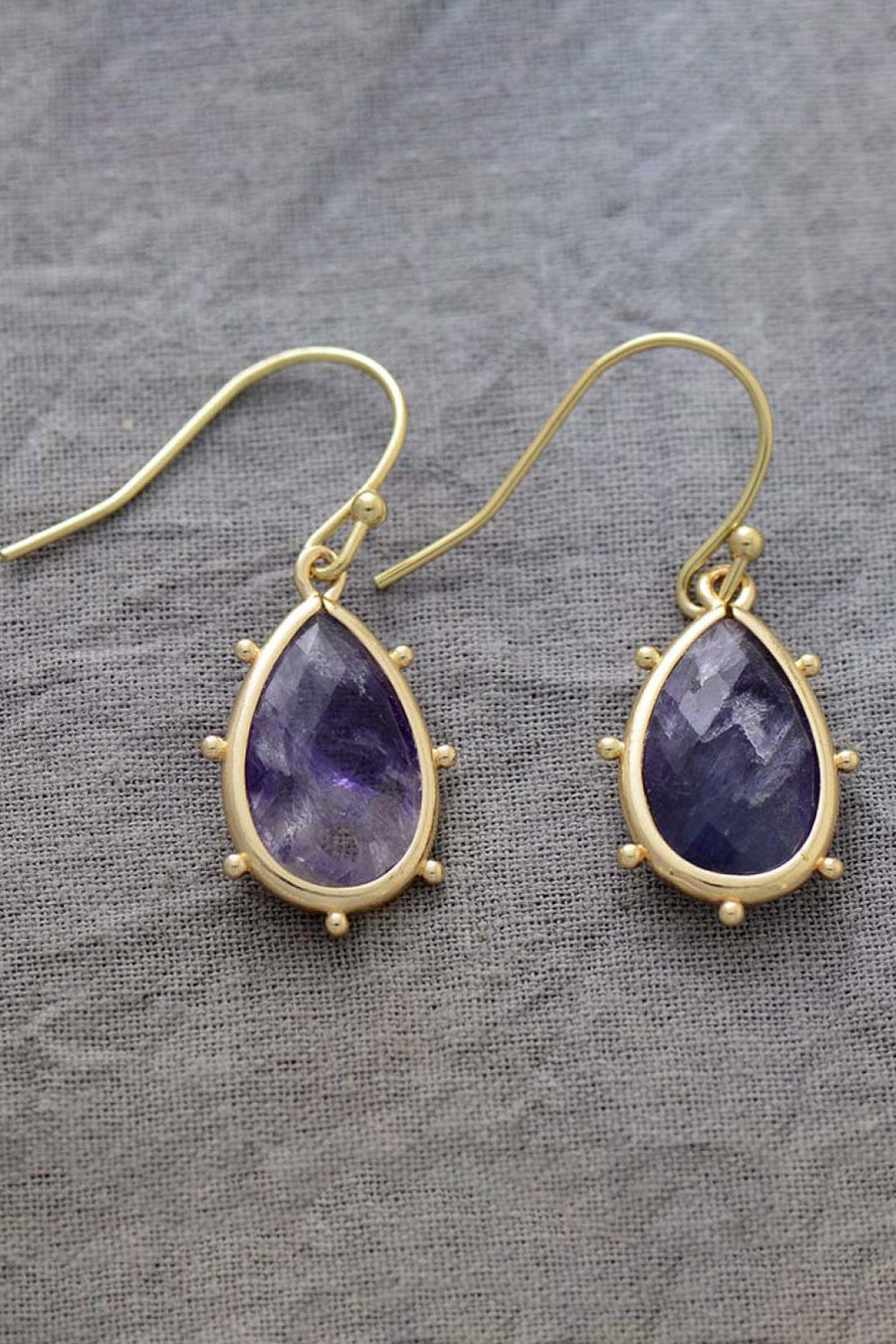 Amethyst teardrop earrings with gold detailing and hook backs