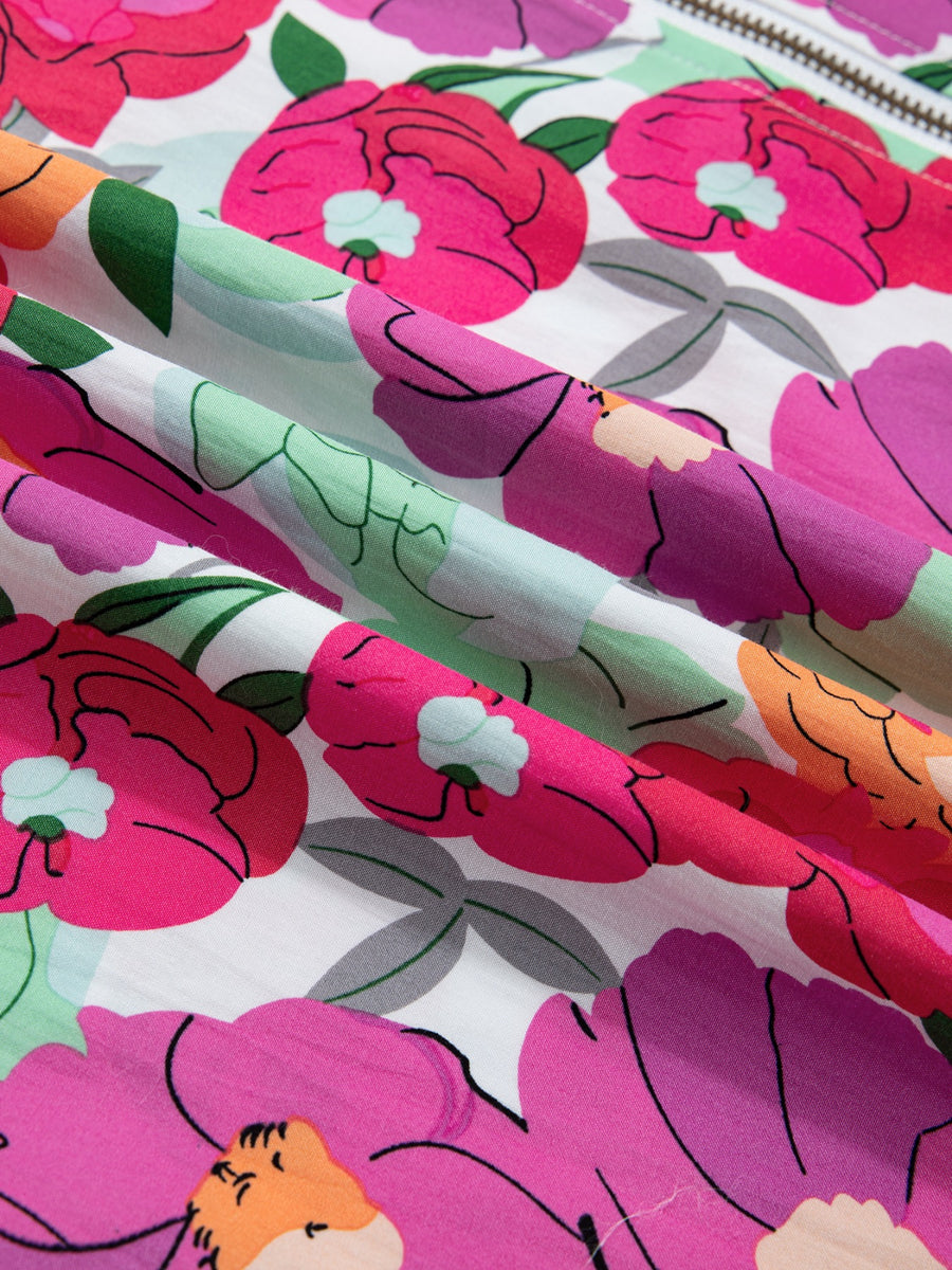 Floral V-neck zip midi dress in cotton with vibrant pink, purple, and orange flowers on white.