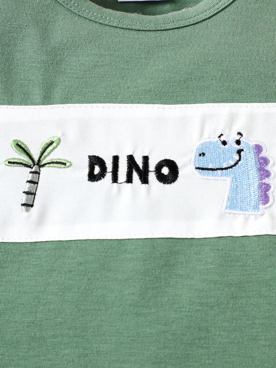 Green cotton tee with embroidered dinosaur and palm tree detail