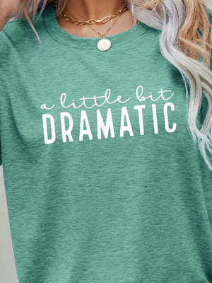 Crew neck tee in Gum Leaf green with white "a little bit DRAMATIC" graphic print