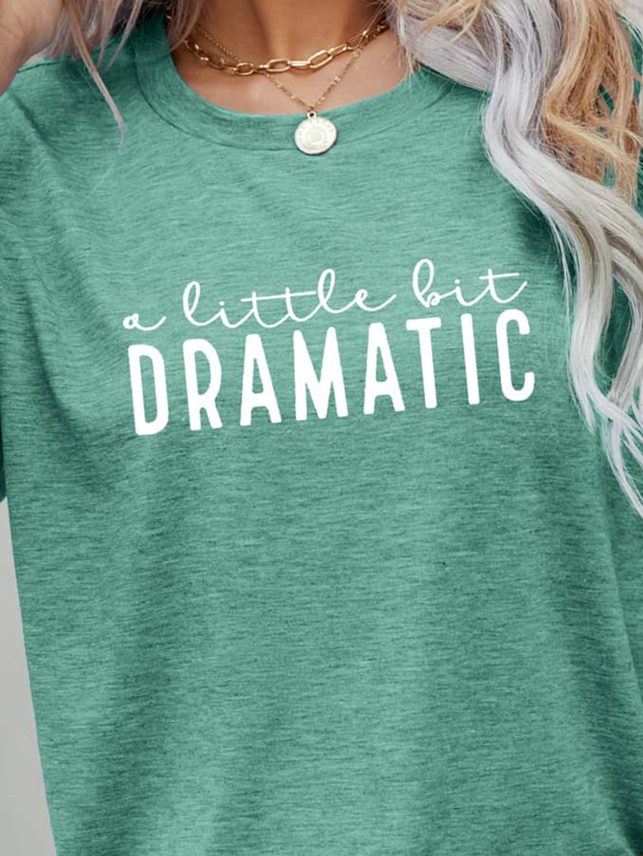 Crew neck tee in Gum Leaf green with white "a little bit DRAMATIC" graphic print