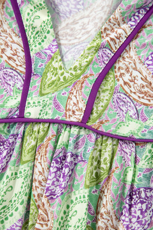 Paisley print blouse with purple trim and gathered detail