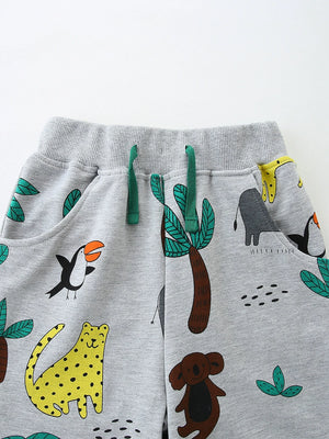 Grey cotton toddler shorts with jungle animal print and green drawstring.