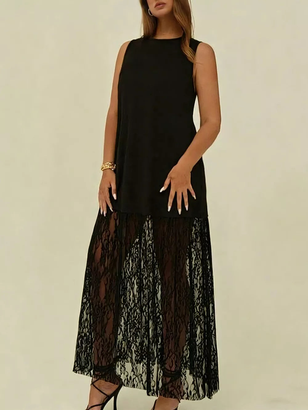 Black sleeveless maxi dress with lace trim skirt and round neckline.