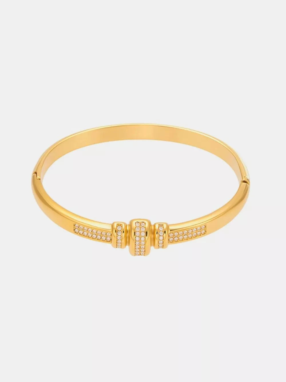 bracelet in gold featuring zircon embellishment and bangle fit