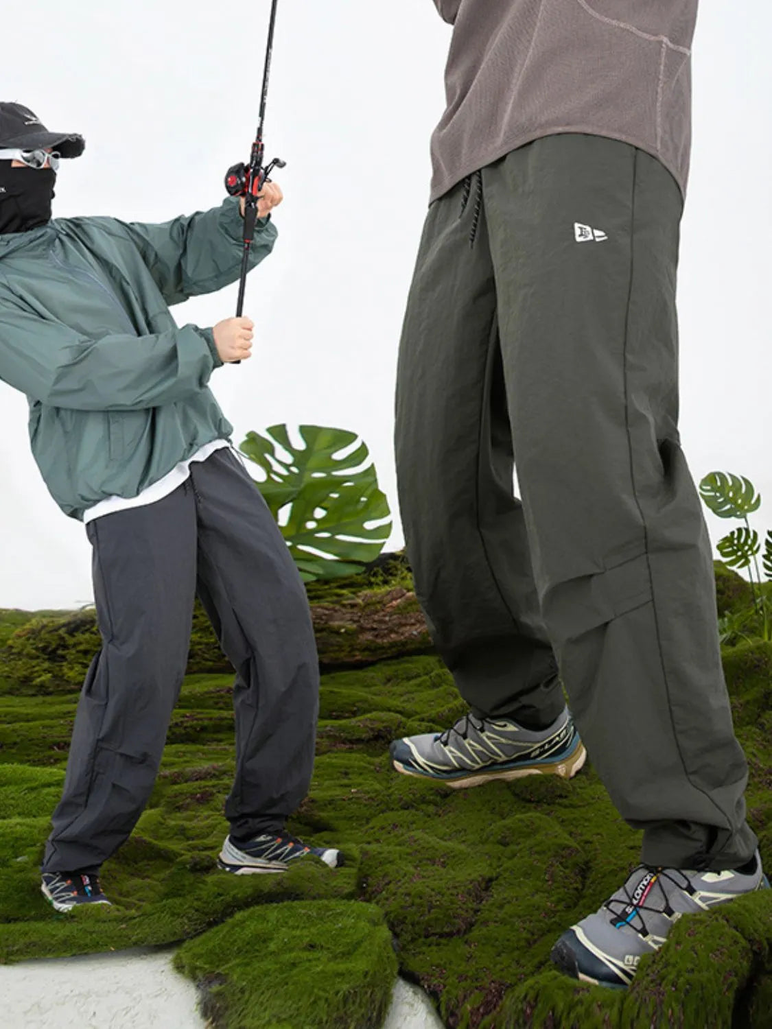Dark gray utility joggers with relaxed fit and cargo pockets.