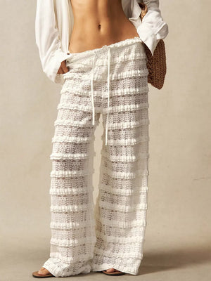 White lace ruffle wide leg pants with drawstring waist.