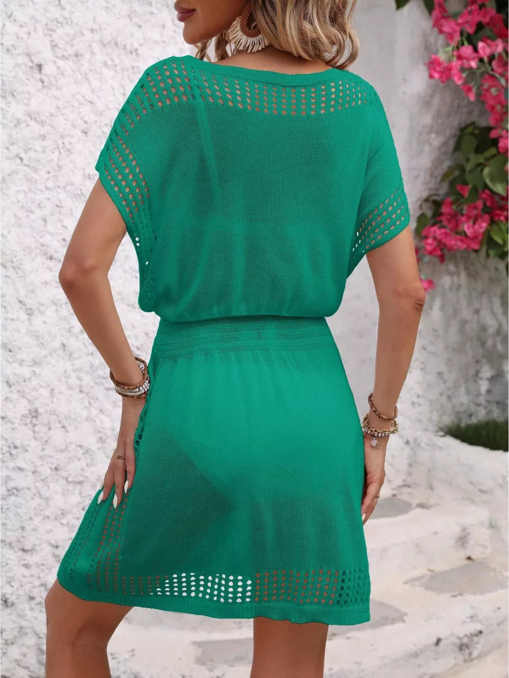 Green perforated knit v-neck cover-up dress with short sleeves and an elastic waist.