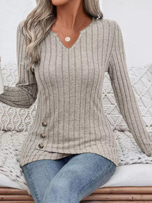 Gray ribbed knit top with notched neckline and button detail