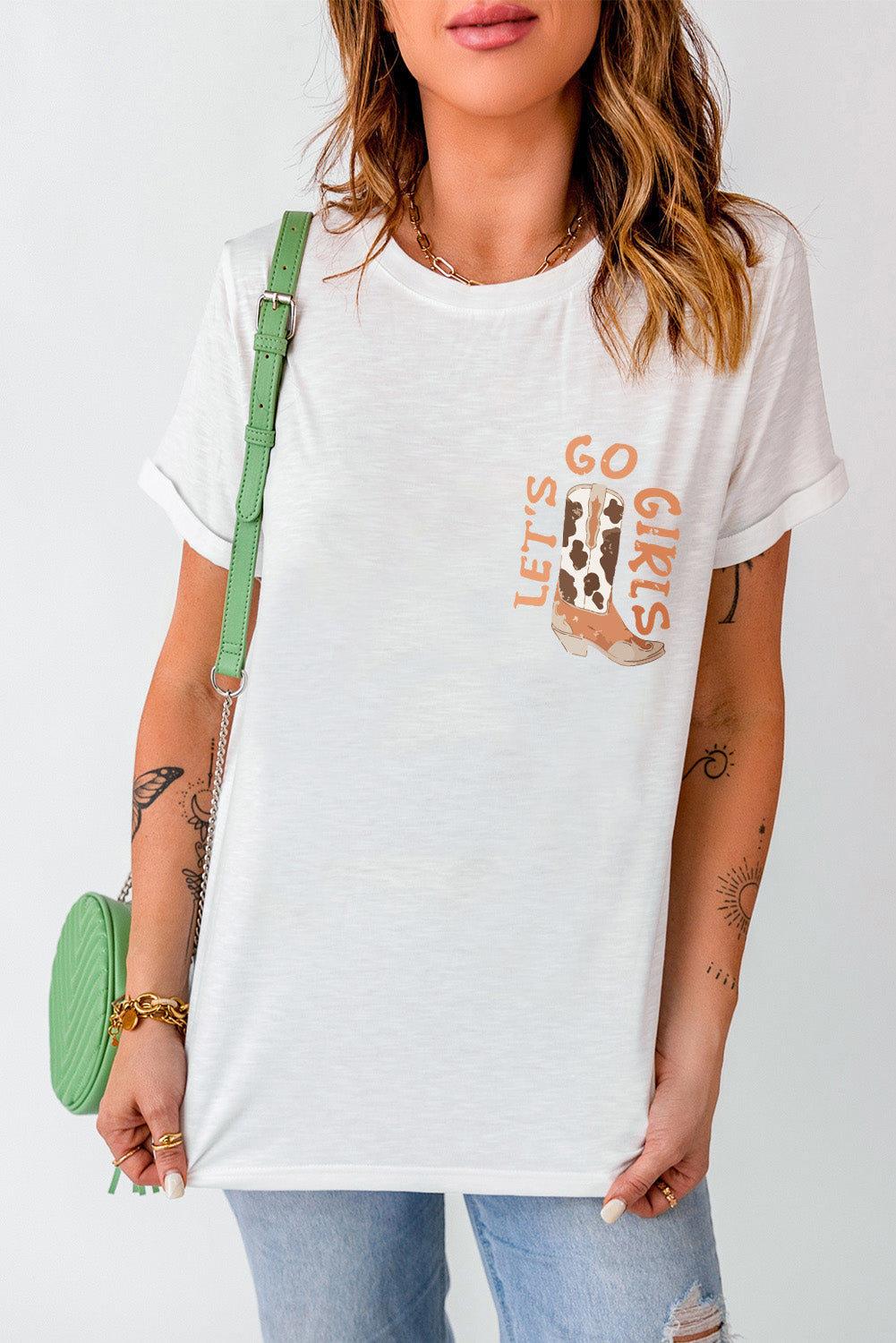 White graphic t-shirt with "Let's Go Girls" and cowboy boot design