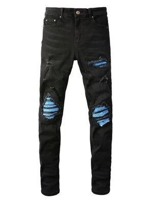 Black distressed denim jeans with blue striped underlay detail