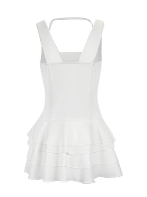 White tiered ruffled mini dress with fitted bodice and square neckline.