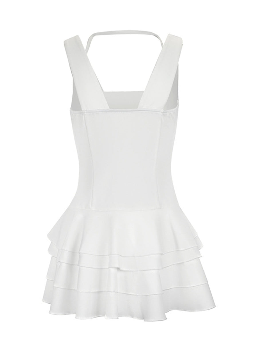 White tiered ruffled mini dress with fitted bodice and square neckline.