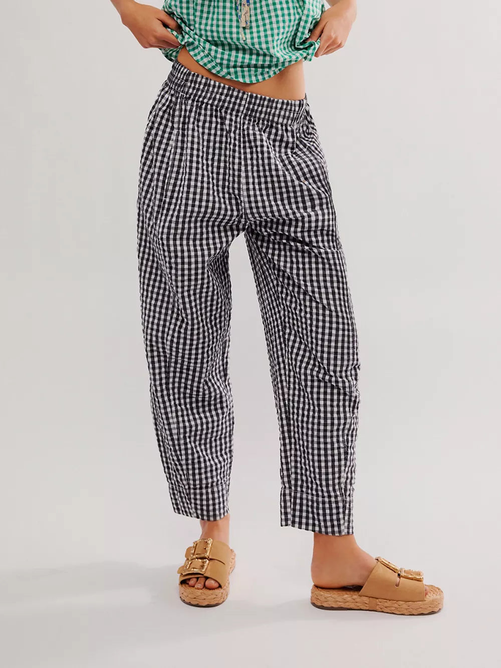 Black gingham check wide-leg pants with pockets and a relaxed fit.