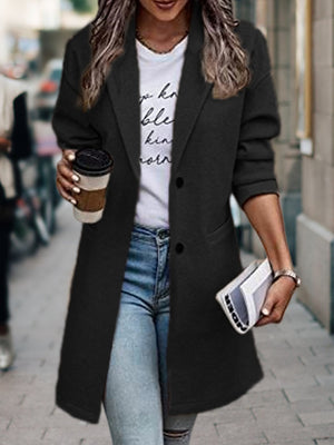 overcoat in black featuring buttoned and regular fit