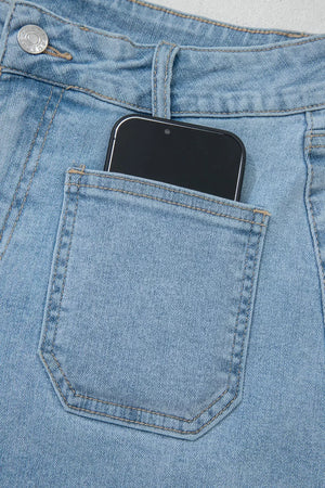 Light wash denim shorts with patch pocket detail, showing a smartphone.